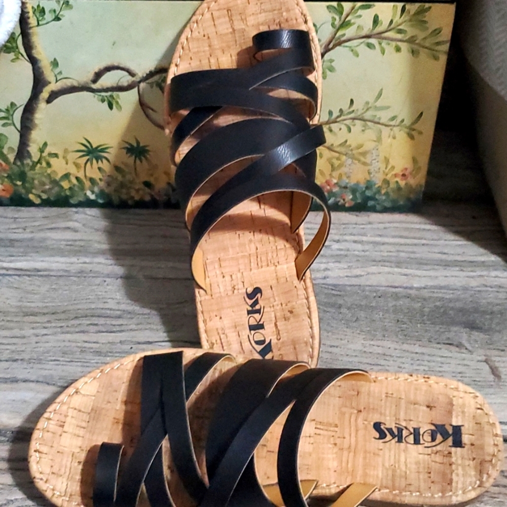 Korks black and tan  gladiator slides